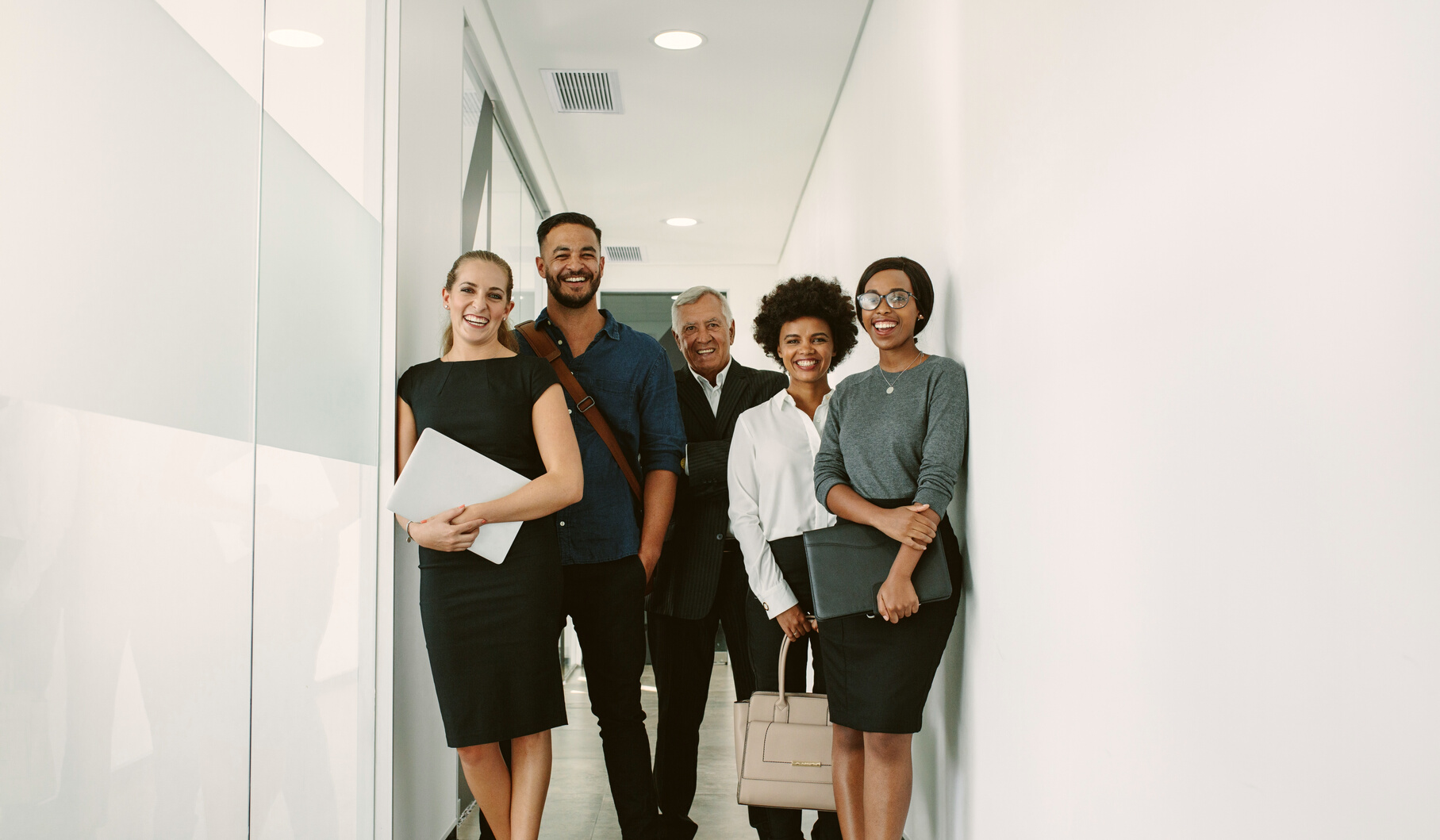 Multiracial Corporate Professionals in Office Hallway